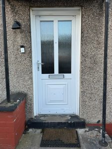 Old uPVC white front door