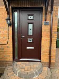 New Rosewood Composite door with decorative glass panels and chrome hardware