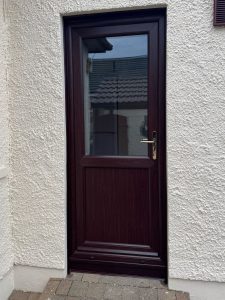 replacement Rosewood uPVC back door with gold hardware