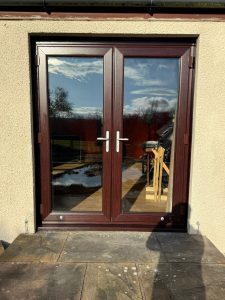 New Replacement Upvc French doors in Rosewood with Satin chrome hardware, INstalled in Maybole
