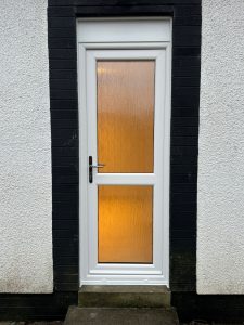 New White uPVC Replacement Back Exterior door with two cotswold glass panes