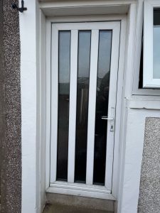 White upvc door with vertical glass panes