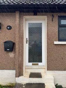 old upvc front door with large glass pane
